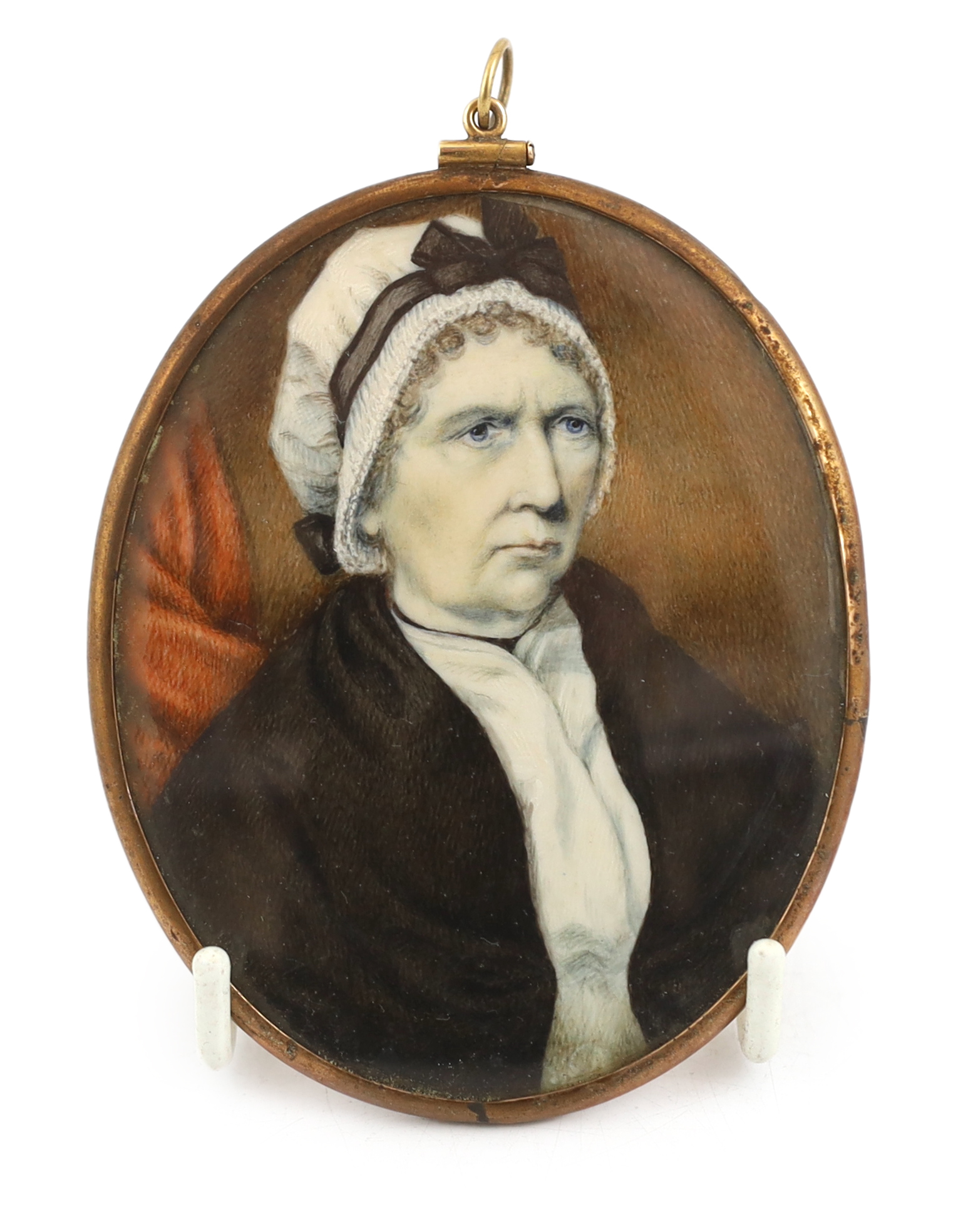 English School circa 1820, Portrait miniature of an elderly lady wearing a bonnet and brown shawl, watercolour on ivory, 8.5 x 7cm. CITES Submission reference UA96HZHB